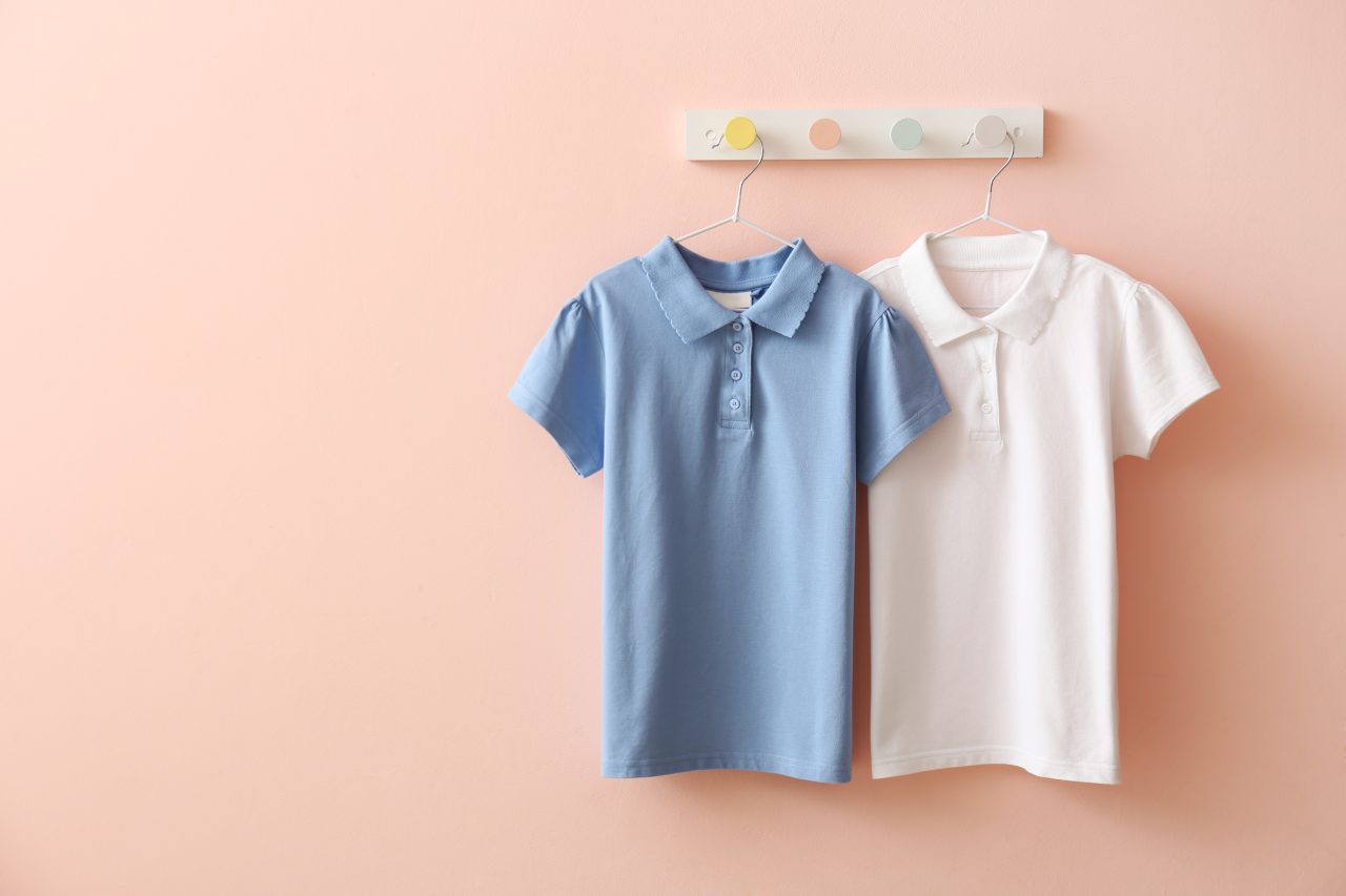 Stylish,School,Uniform,Hanging,On,Color,Wall