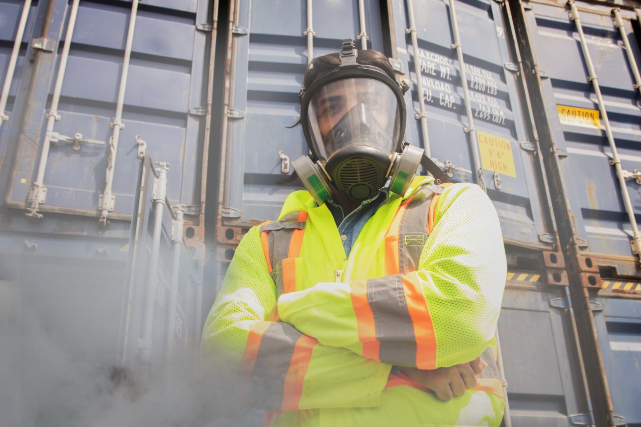 Male,Rescue,Worker,Wearing,Ppe,Suit,Standing,With,Arms,Crossed